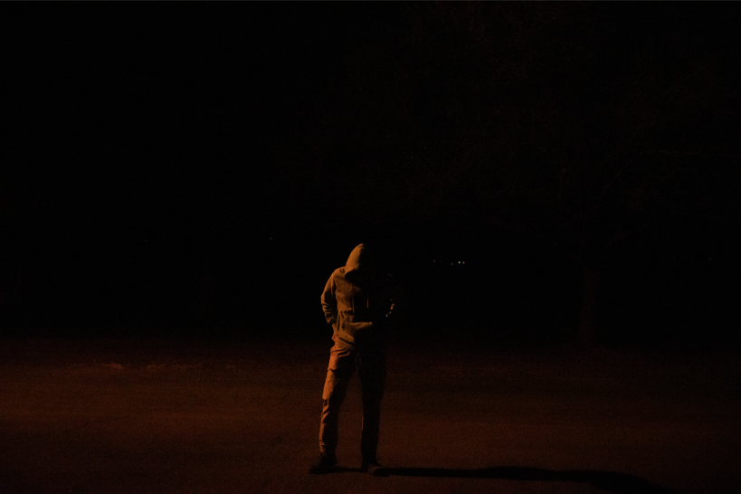 Crew working under lights during a night shoot.